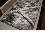 Modern decor ideas - Close up image of a grey, white and black modern abstract painting on a table