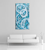 Image of a large, tall, light blue and turquoise abstract, acrylic painting featuring modern white circles. The painting is on a white wall above a couch.