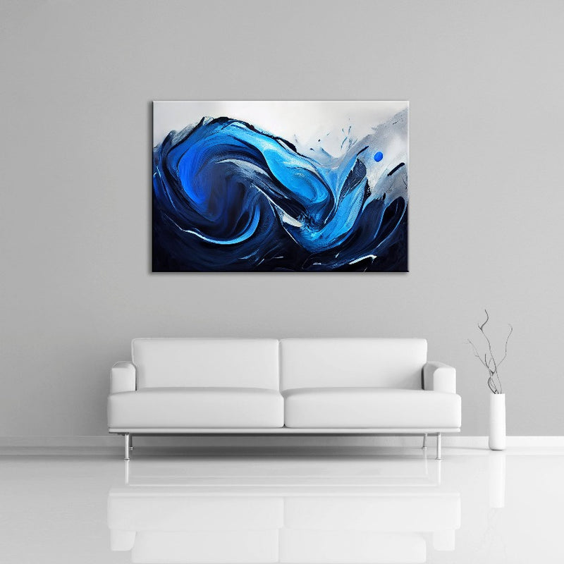 An abstract painting featuring blue and white paint displayed over a couch.