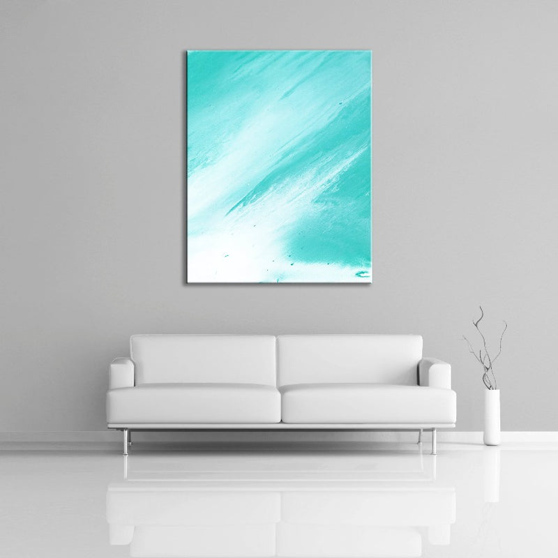 A contemporary abstract painting featuring the colours green and blue. Displayed over a couch.