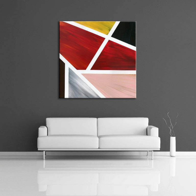 A geometric abstract painting featuring the colours black, red, yellow pink and brown. Displayed on a wall.