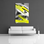 A modern abstract painting featuring the colours neon yellow, black, white and gray. Displayed on a wall.
