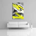 A modern abstract painting featuring the colours gray, white, neon yellow and black. Displayed over a couch.