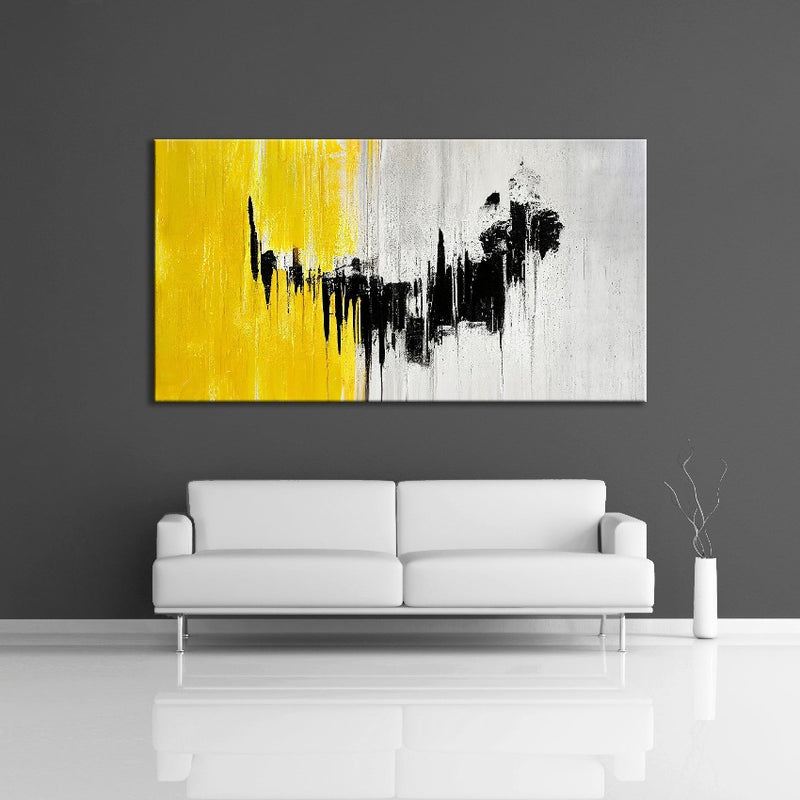 A modern abstract painting featuring the colours yellow, gray and black. Displayed on a wall.