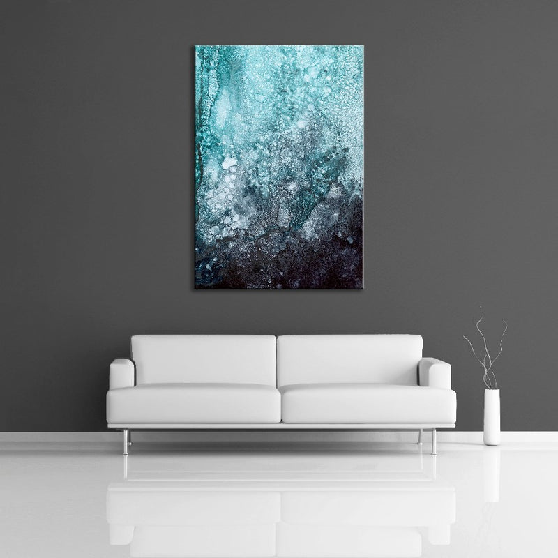 A modern abstract alcohol ink painting featuring the colours black, blue, green and white. Displayed on a wall.