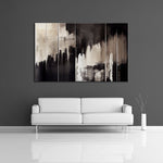 An abstract painting featuring the colors black and cream. Displayed over a couch..