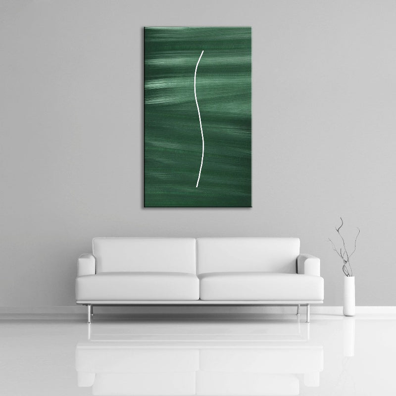 A abstract painting featuring the colours green and white. Displayed over a couch.