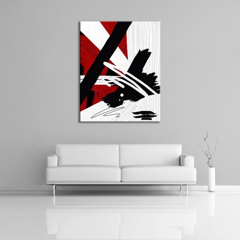 An abstract painting featuring the colours black, white and red. Displayed over a couch.