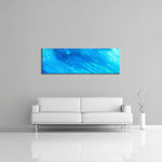 A modern abstract painting featuring the colours  light and dark blue. Displayed on a wall.