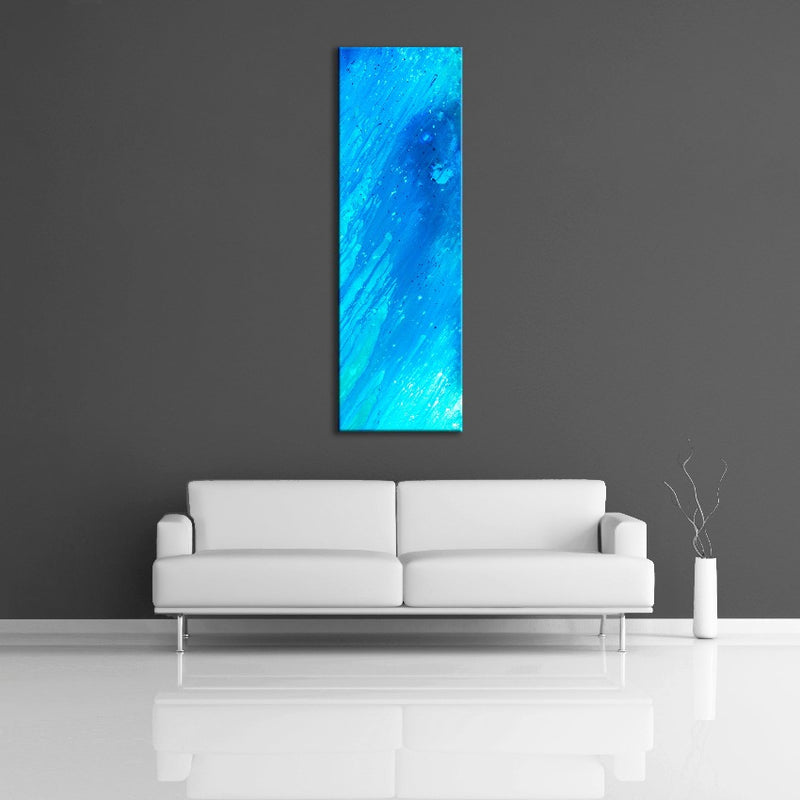 A modern abstract painting featuring the colours  light and dark blue. Displayed vertically on wall.