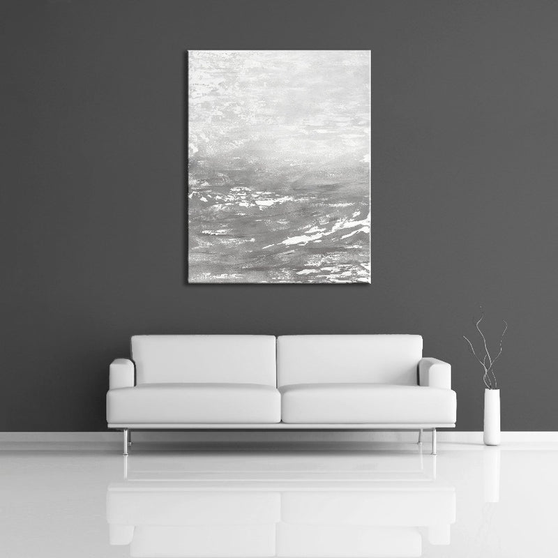 A modern abstract painting featuring the colours silver, gray and white. Displayed over a couch.