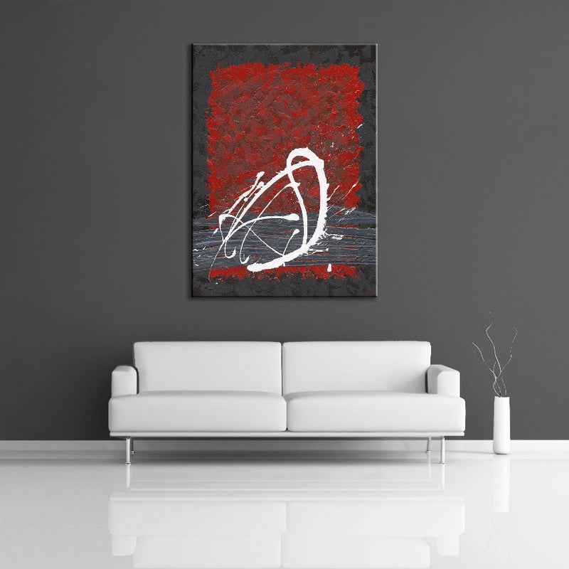 A modern abstract painting featuring the colours black, gray, red and white. Displayed on wall.