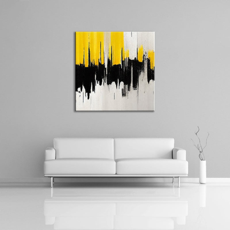 An abstract painting featuring off-white, black and yellow.  Displayed over a couch.